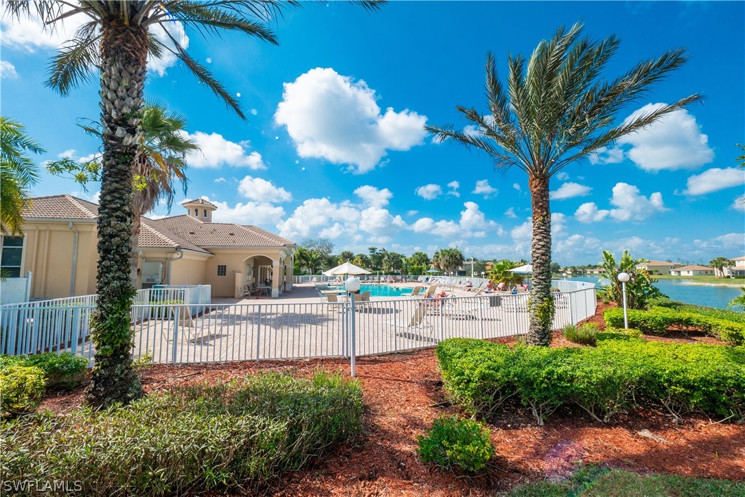 11677 Eros Road Lehigh Acres, FL 33971 - Photo 25 of 27 a view of a house with a yard and potted plants