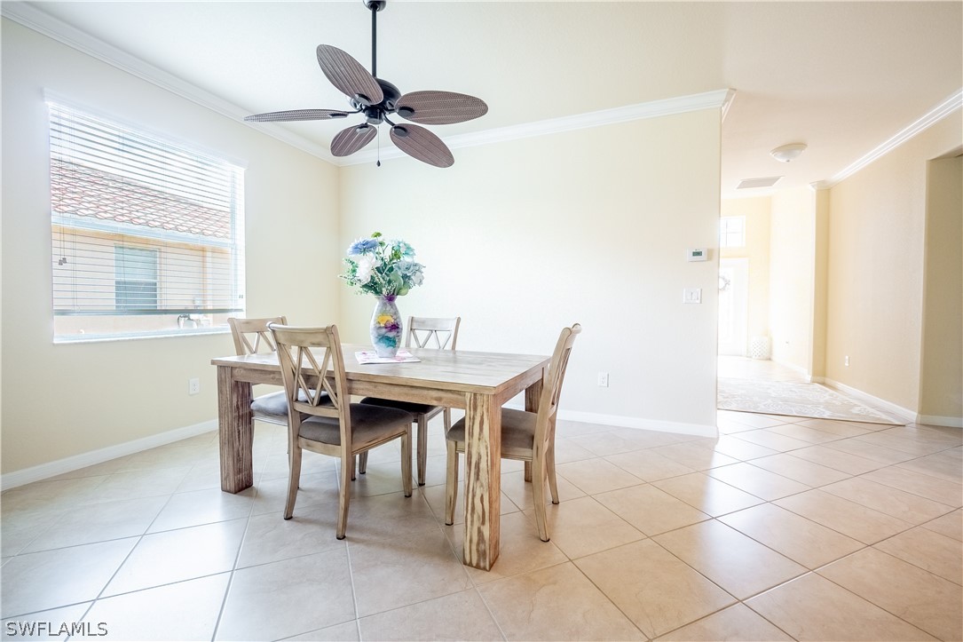11677 Eros Road Lehigh Acres, FL 33971 - Photo 4 of 27 a dining room with furniture and window