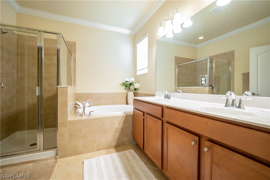 11677 Eros Road Lehigh Acres, FL 33971 - Photo 8 of 27 a bathroom with a double vanity sink mirror and shower
