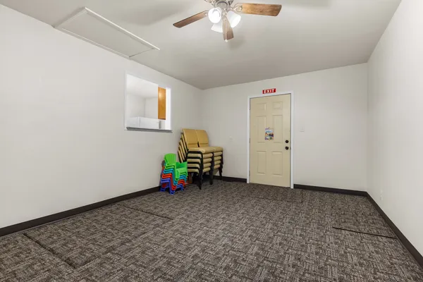 a view of an empty room with a window