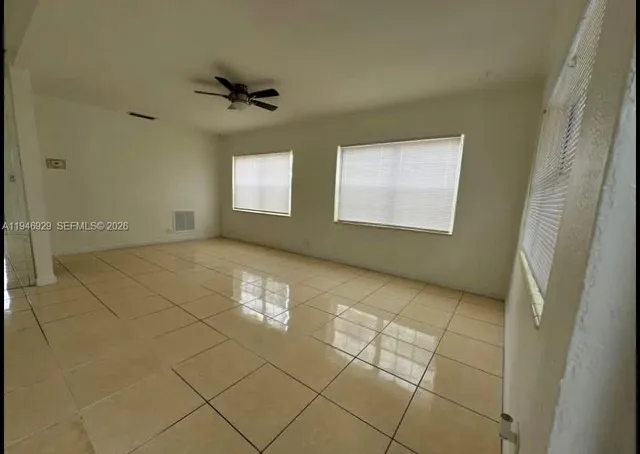 en empty room with windows