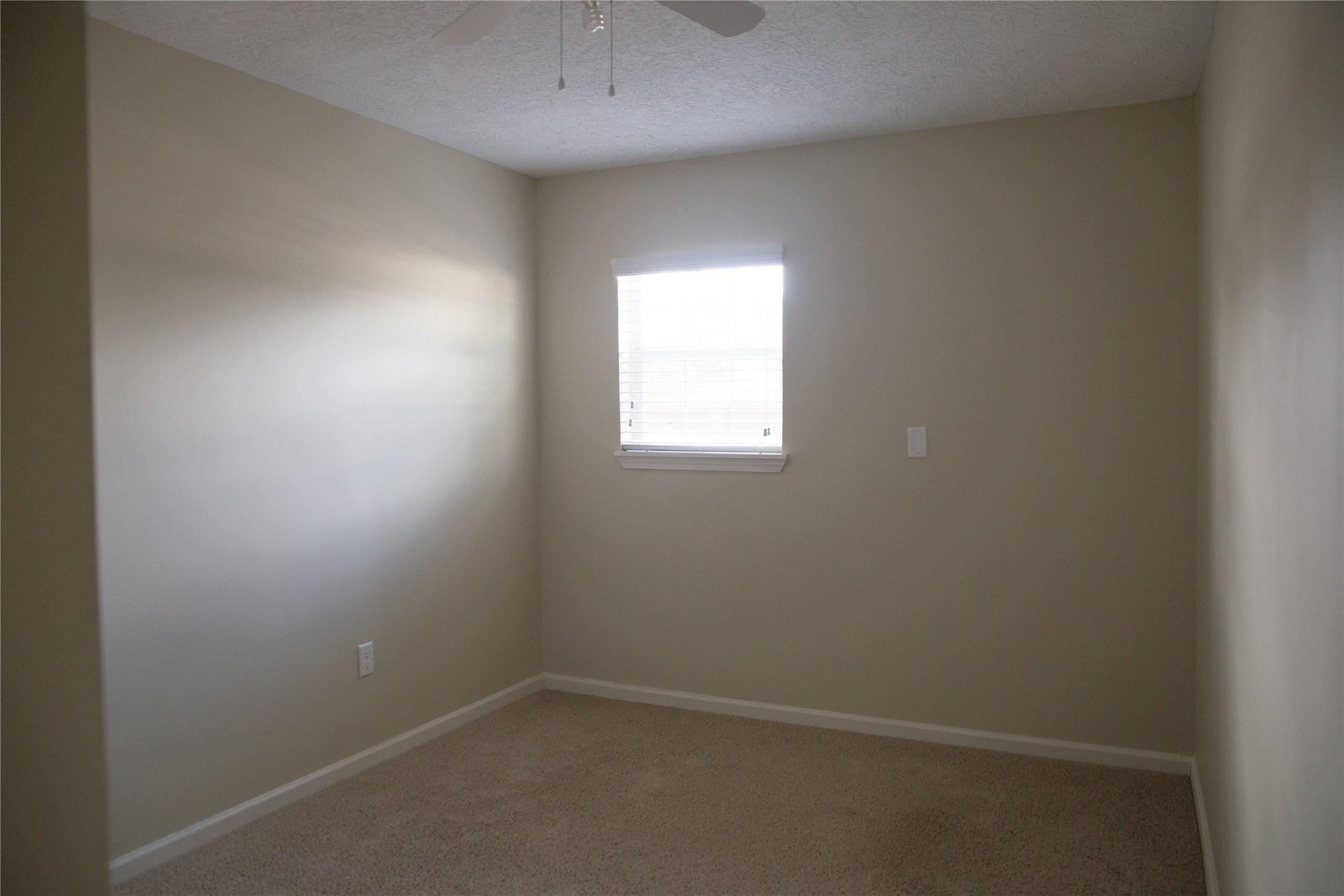 16947 Avenue A Channelview, TX 77530 - Photo 11 of 12 an empty room with a window