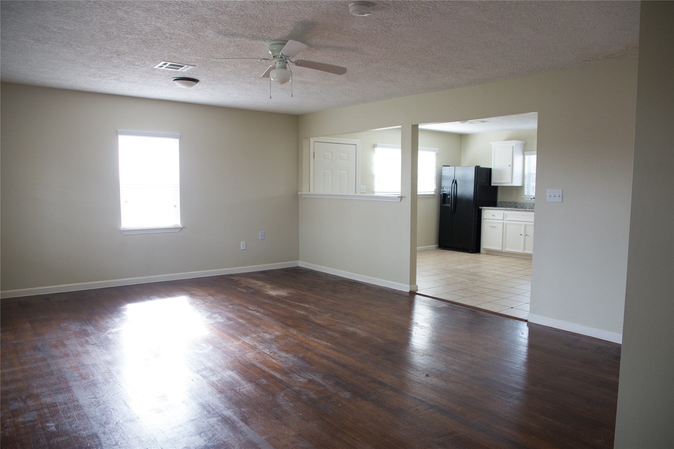 16947 Avenue A Channelview, TX 77530 - Photo 3 of 12 a view of a room with wooden floor and staircase