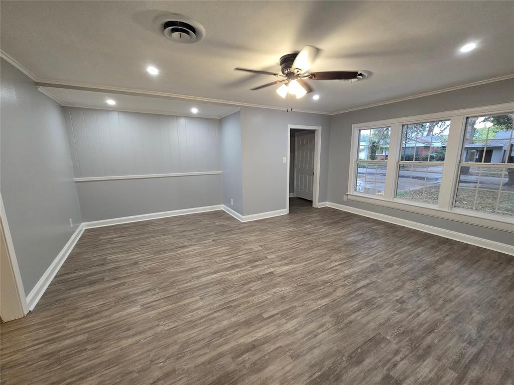 233 Roma Drive Shreveport, LA 71105 - Photo 7 of 12 Spare room with dark wood-style flooring, ornamental molding, a ceiling fan, and recessed lighting