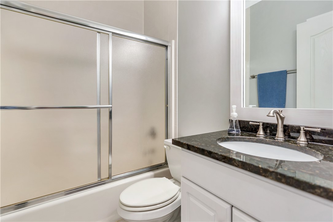 3108 Cobbs Way Anderson, SC 29621 - Photo 29 of 44 This bathroom features a contemporary vanity with a sleek granite countertop and a practical shower-tub combination.