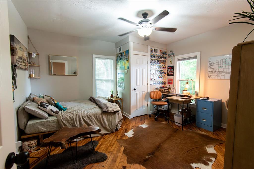 702 Radford Street Monroe, GA 30655 - Photo 18 of 49 a living room with furniture chess board and a window