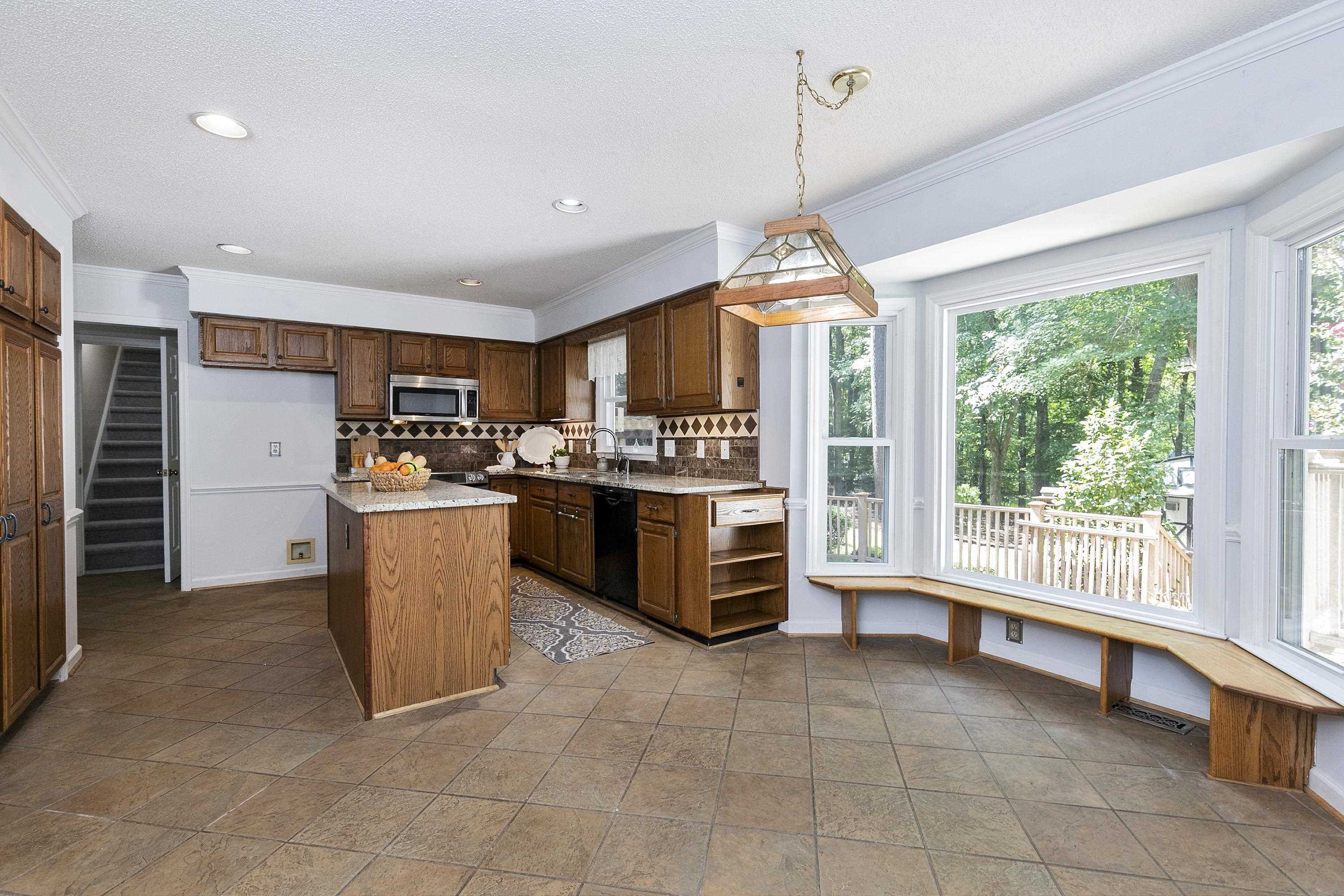 11305 Old Creedmoor Road Raleigh, NC 27613 - Photo 11 of 33 Breastfast Area with Built-in Seating off Kitchen