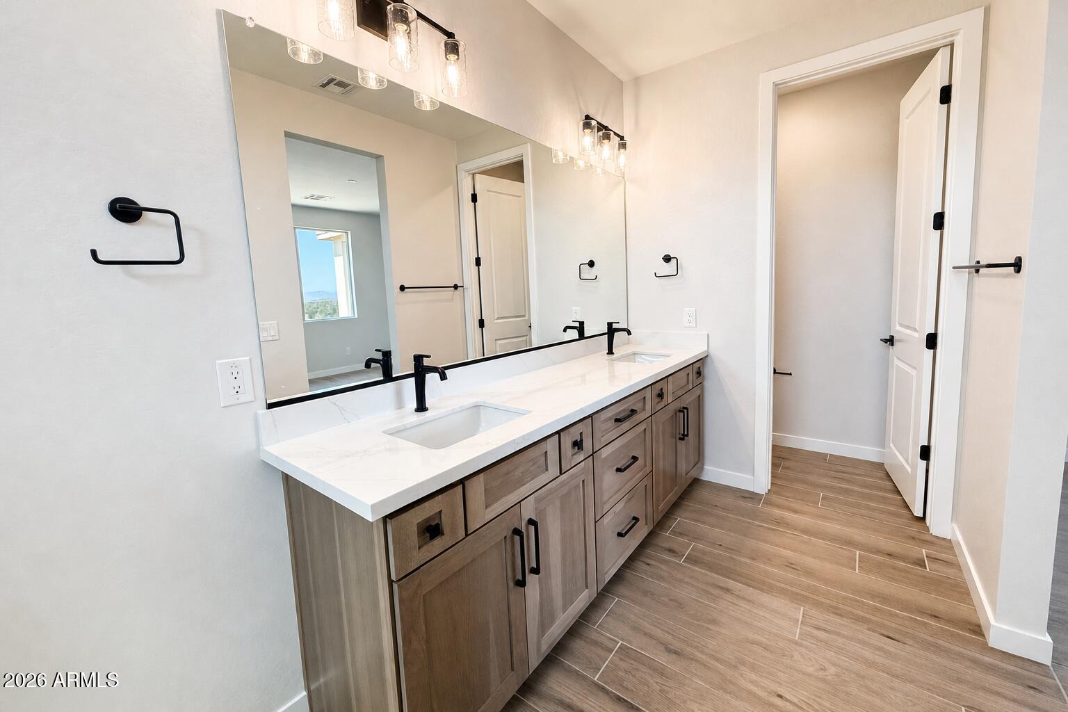 16957 East Bobwhite Way Rio Verde, AZ 85263 - Photo 16 of 25 a bathroom with double vanity and mirrors