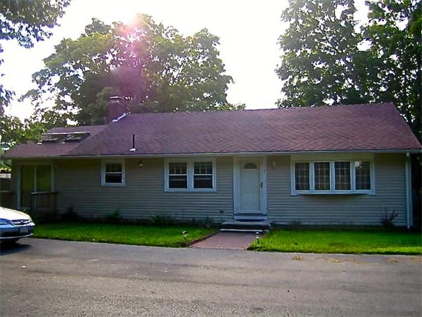 7 Lexington Road Billerica, MA 01821 - Photo 1 of 20 a front view of a house with a yard and a garage