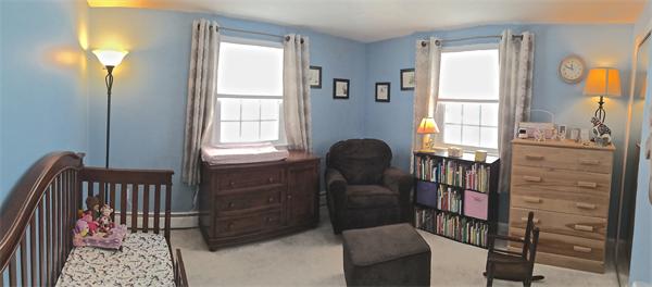 7 Lexington Road Billerica, MA 01821 - Photo 12 of 20 a bedroom with a bed and wooden floor