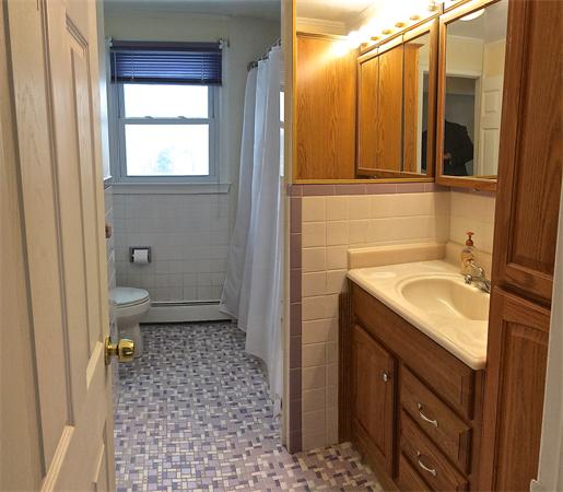 7 Lexington Road Billerica, MA 01821 - Photo 13 of 20 a bathroom with a sink a toilet and shower