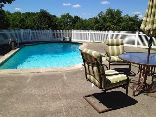 7 Lexington Road Billerica, MA 01821 - Photo 19 of 20 a roof deck with table and chairs and wooden fence