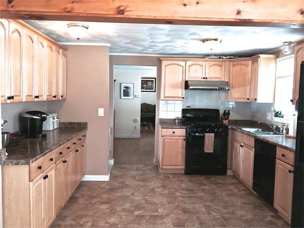 7 Lexington Road Billerica, MA 01821 - Photo 7 of 20 a kitchen with stainless steel appliances granite countertop a stove a sink and a refrigerator