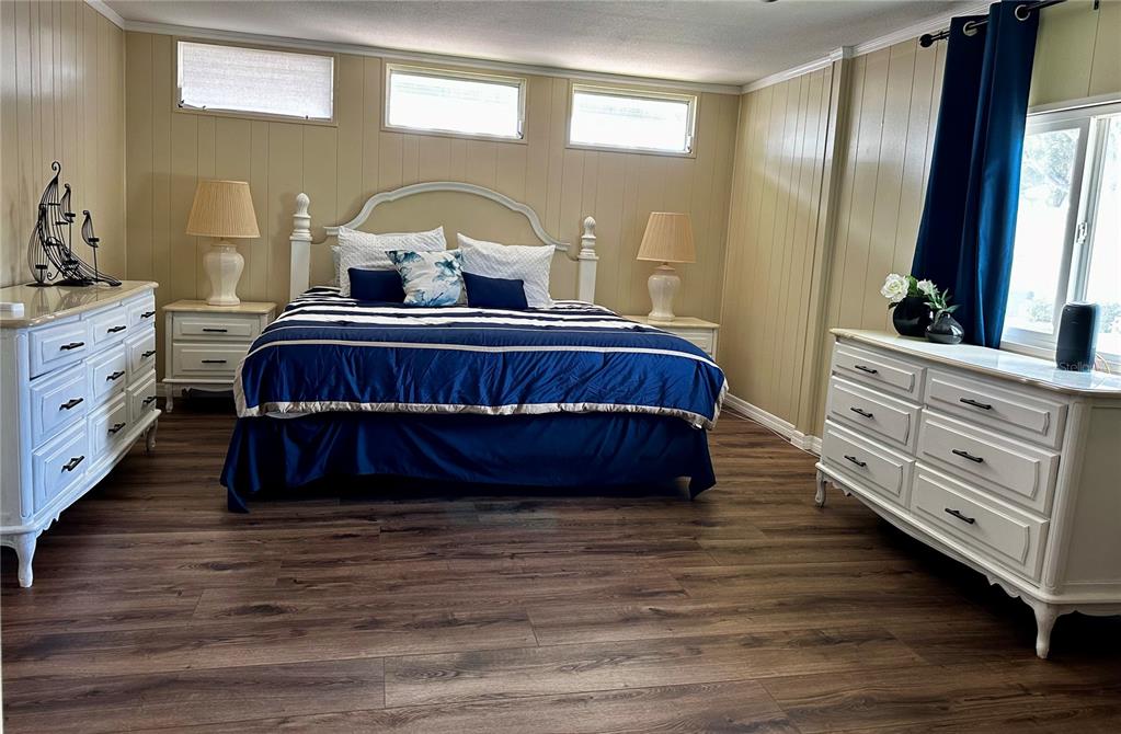 1100 South Belcher Road, Unit 454 Largo, FL 33771 - Photo 15 of 61 a bedroom with a bed and a dresser