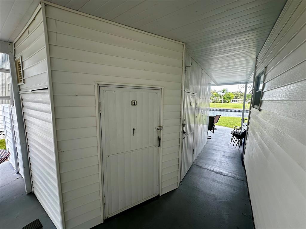 1100 South Belcher Road, Unit 454 Largo, FL 33771 - Photo 26 of 61 a view of a hallway with wooden floor and a bathroom