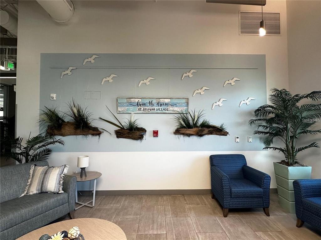 1100 South Belcher Road, Unit 454 Largo, FL 33771 - Photo 35 of 61 a living room with furniture and flowers