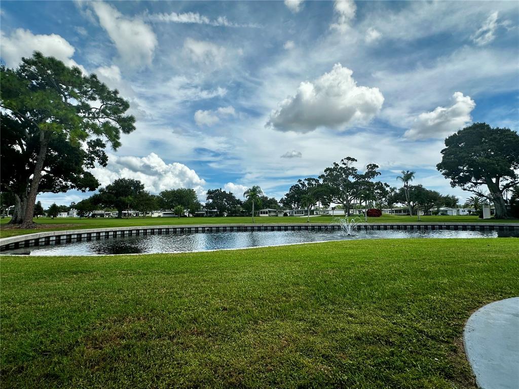 1100 South Belcher Road, Unit 454 Largo, FL 33771 - Photo 4 of 61 a view of a lake with houses in back