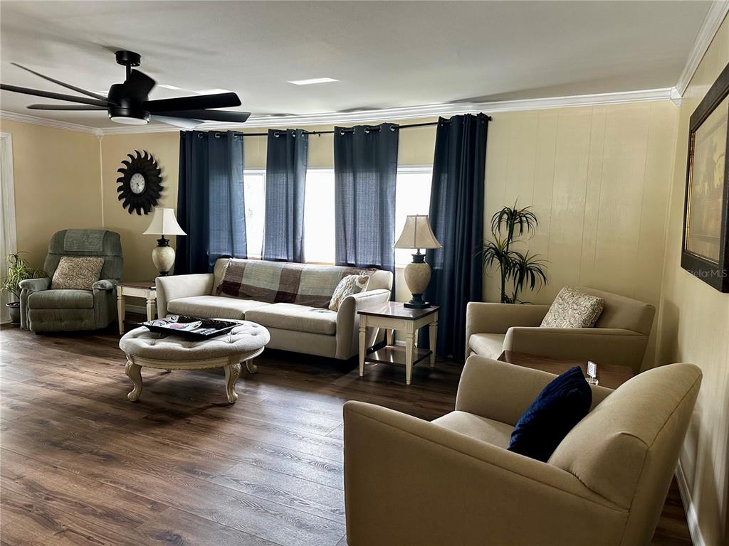 1100 South Belcher Road, Unit 454 Largo, FL 33771 - Photo 6 of 61 a living room with furniture and a large window