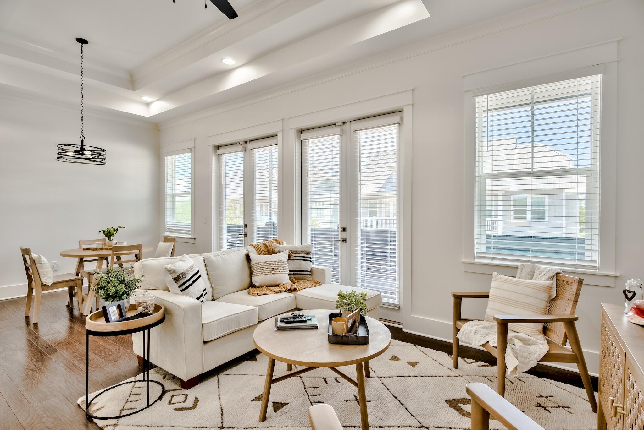 60 Milestone Dr Inlet Beach, Unit C Inlet Beach, FL 32461 - Photo 5 of 21 a living room with furniture and floor to ceiling windows