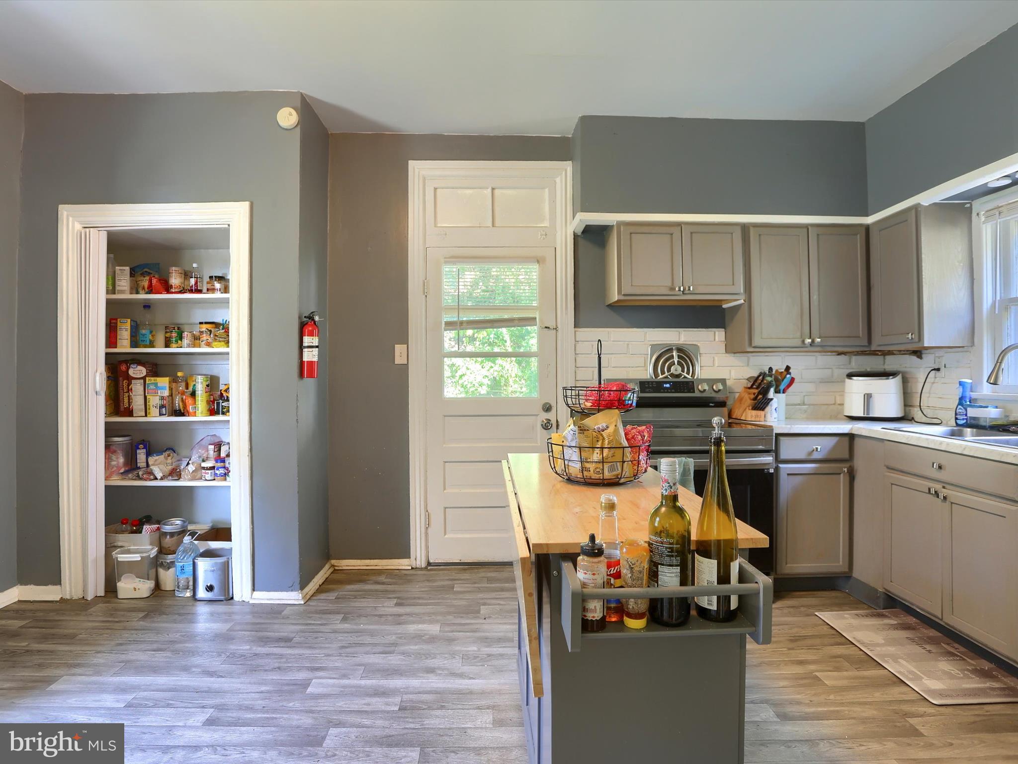 241 Pine Street Steelton, PA 17113 - Photo 15 of 32 a living room with furniture a window and kitchen view