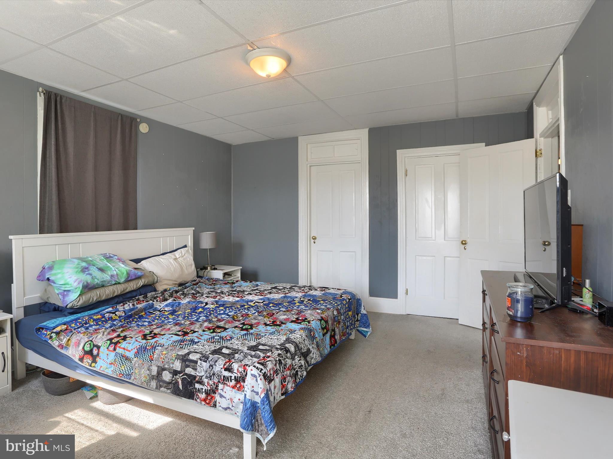 241 Pine Street Steelton, PA 17113 - Photo 25 of 32 a bedroom with bed and flat screen tv