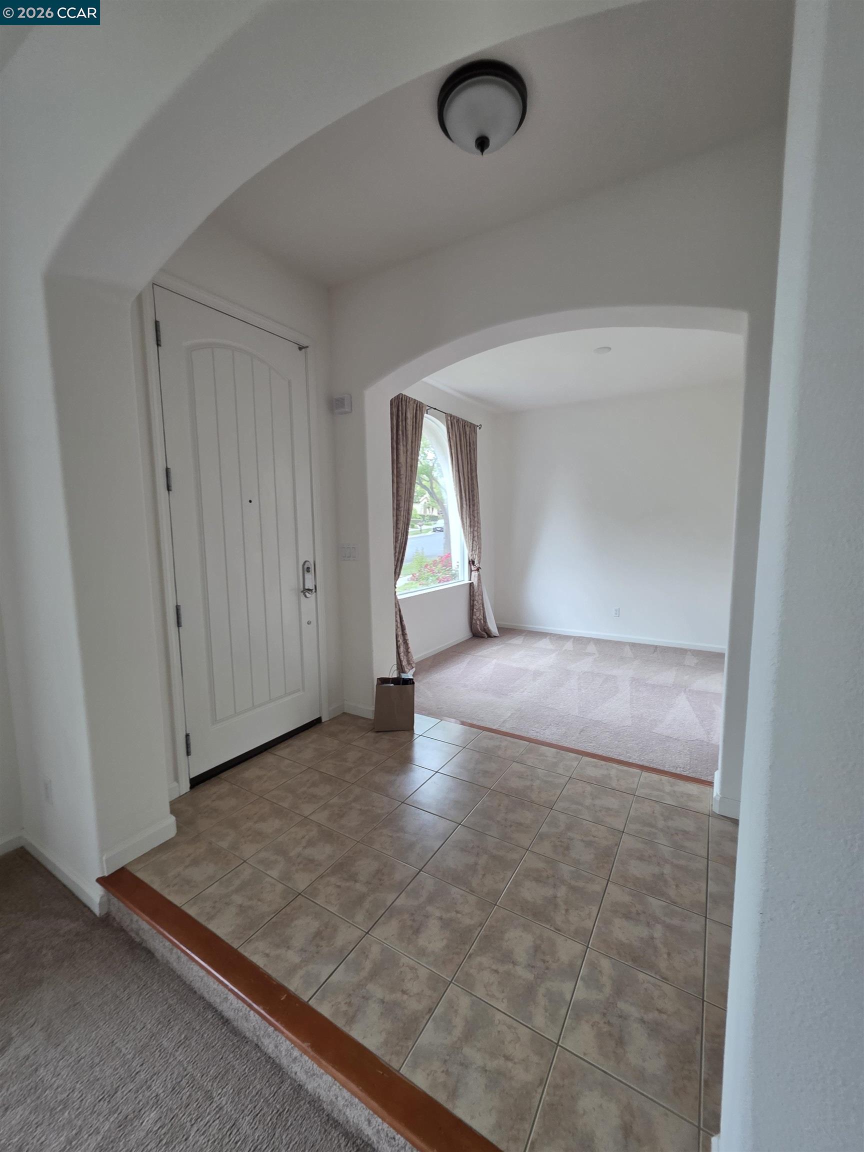 1830 Hollyview Drive San Ramon, CA 94582 - Photo 2 of 36 an empty room with an entryway and window