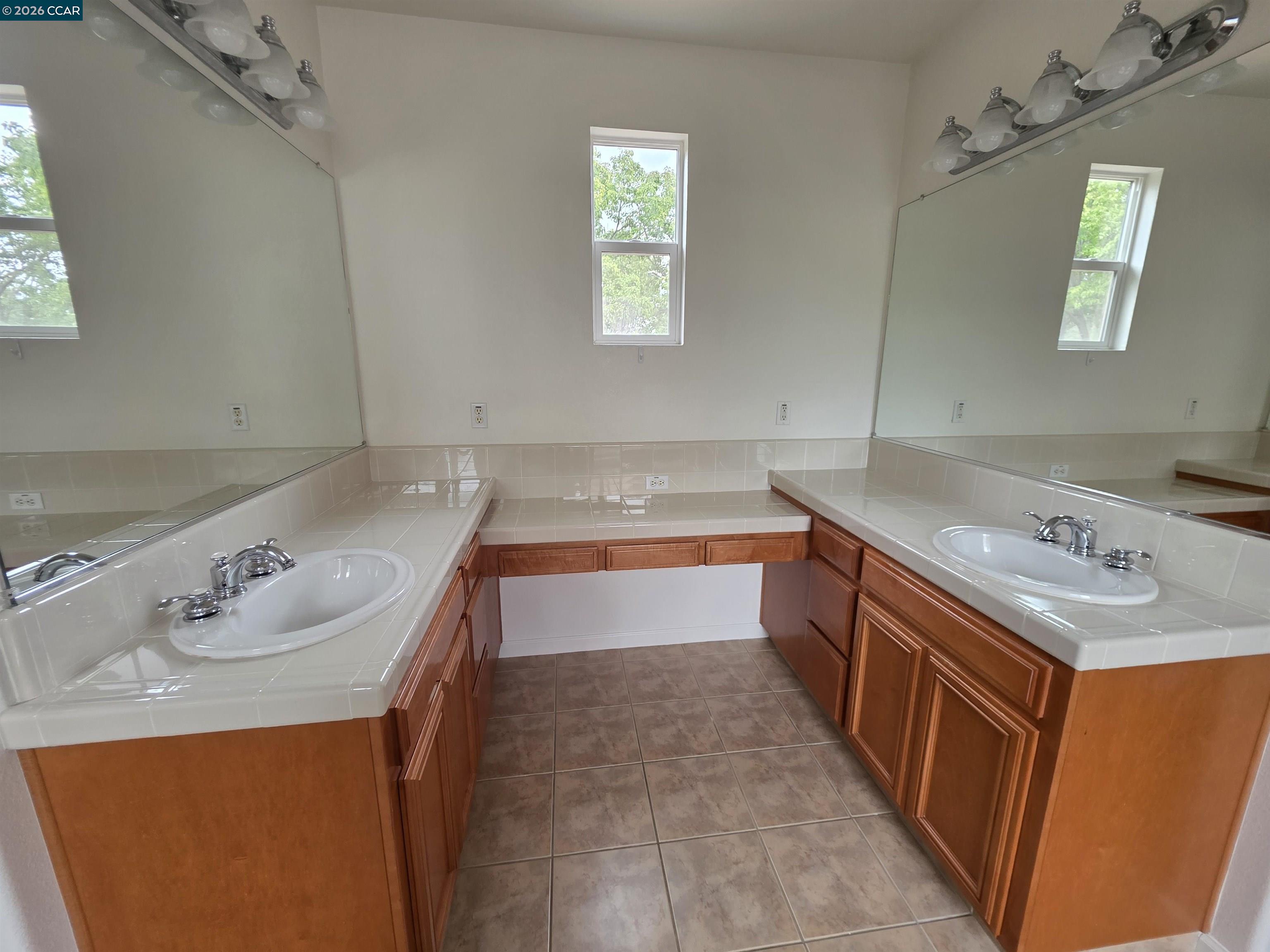 1830 Hollyview Drive San Ramon, CA 94582 - Photo 23 of 36 a bathroom with a tub sink and mirror