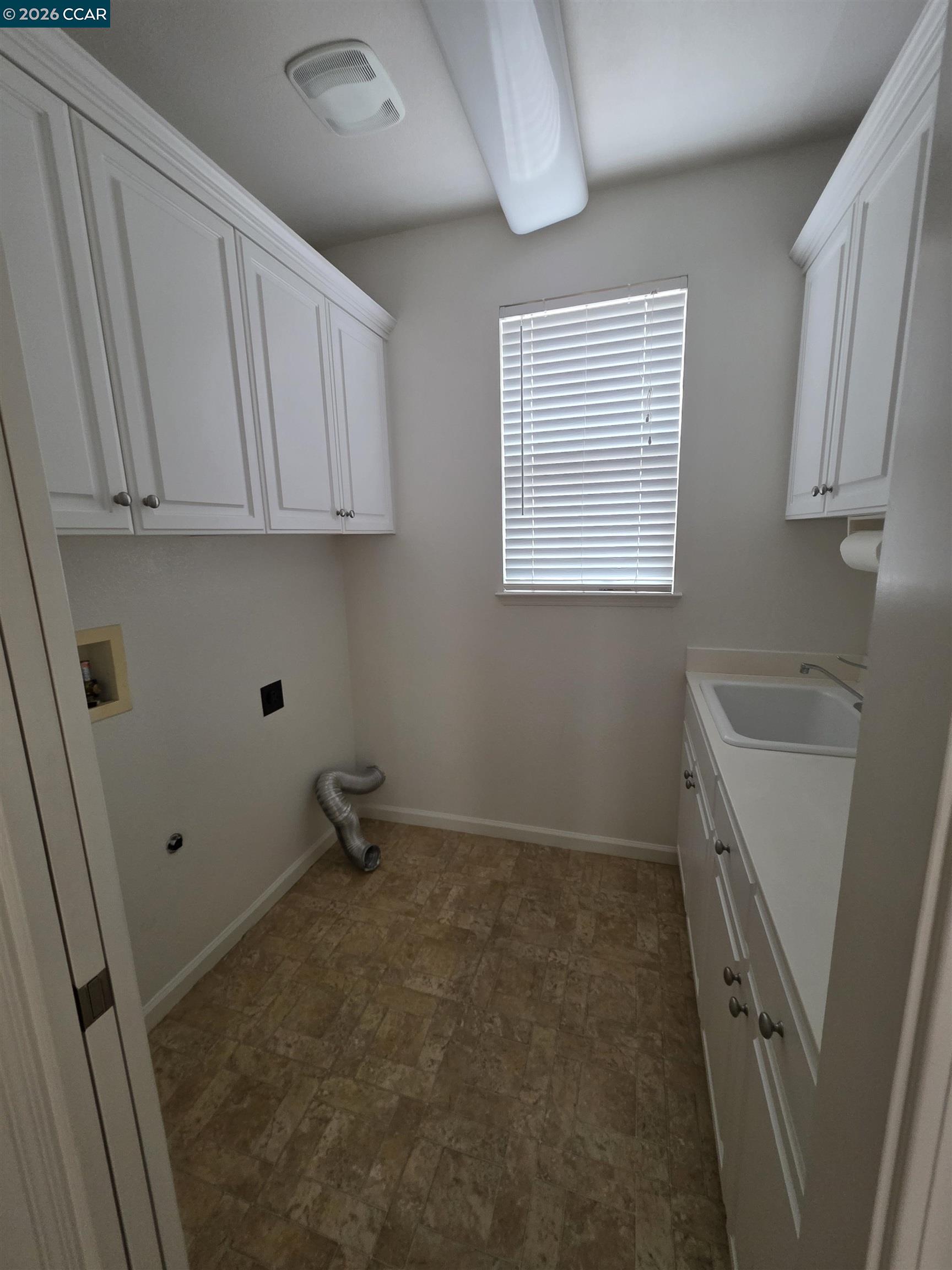 1830 Hollyview Drive San Ramon, CA 94582 - Photo 32 of 36 a storage room with wooden floor washer and dryer