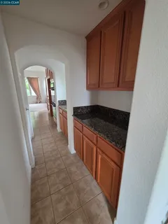 a kitchen with a stove a microwave and a sink