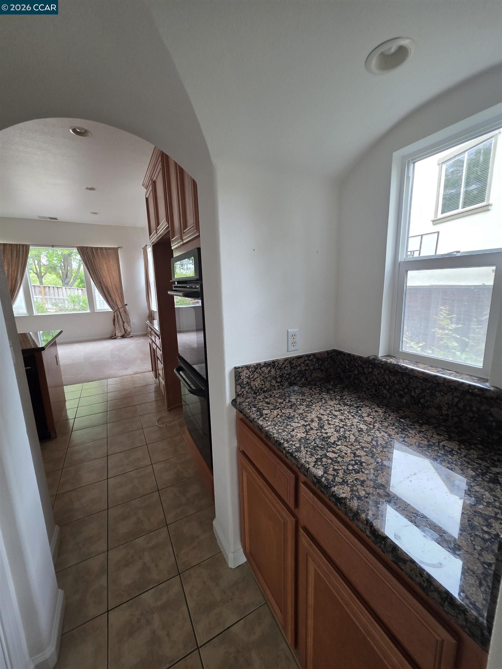 1830 Hollyview Drive San Ramon, CA 94582 - Photo 7 of 36 wooden floor in an empty room with a window