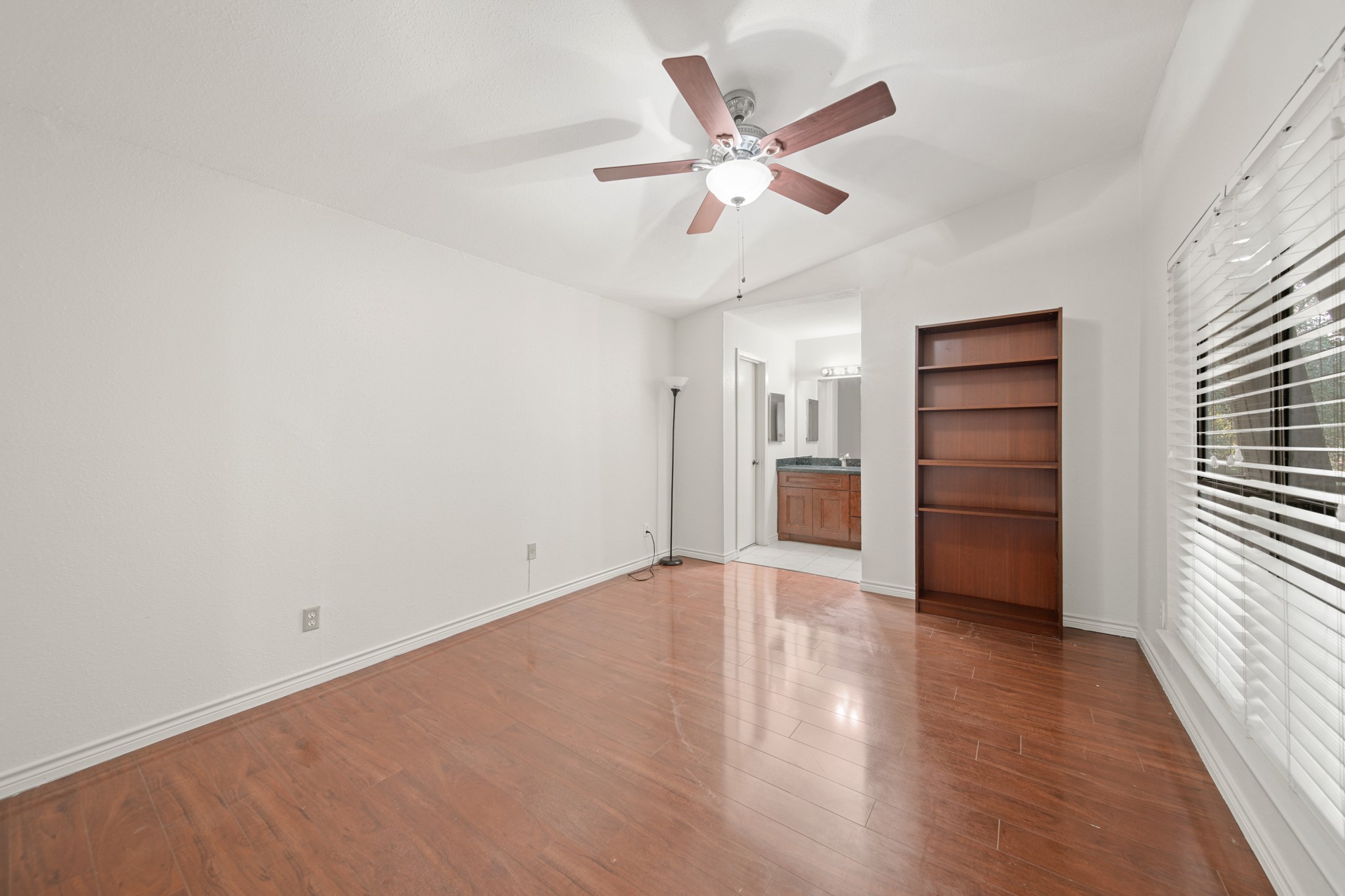 8100 Cambridge Street, Unit 6 Houston, TX 77054 - Photo 14 of 23 wooden floor in an empty room with a window