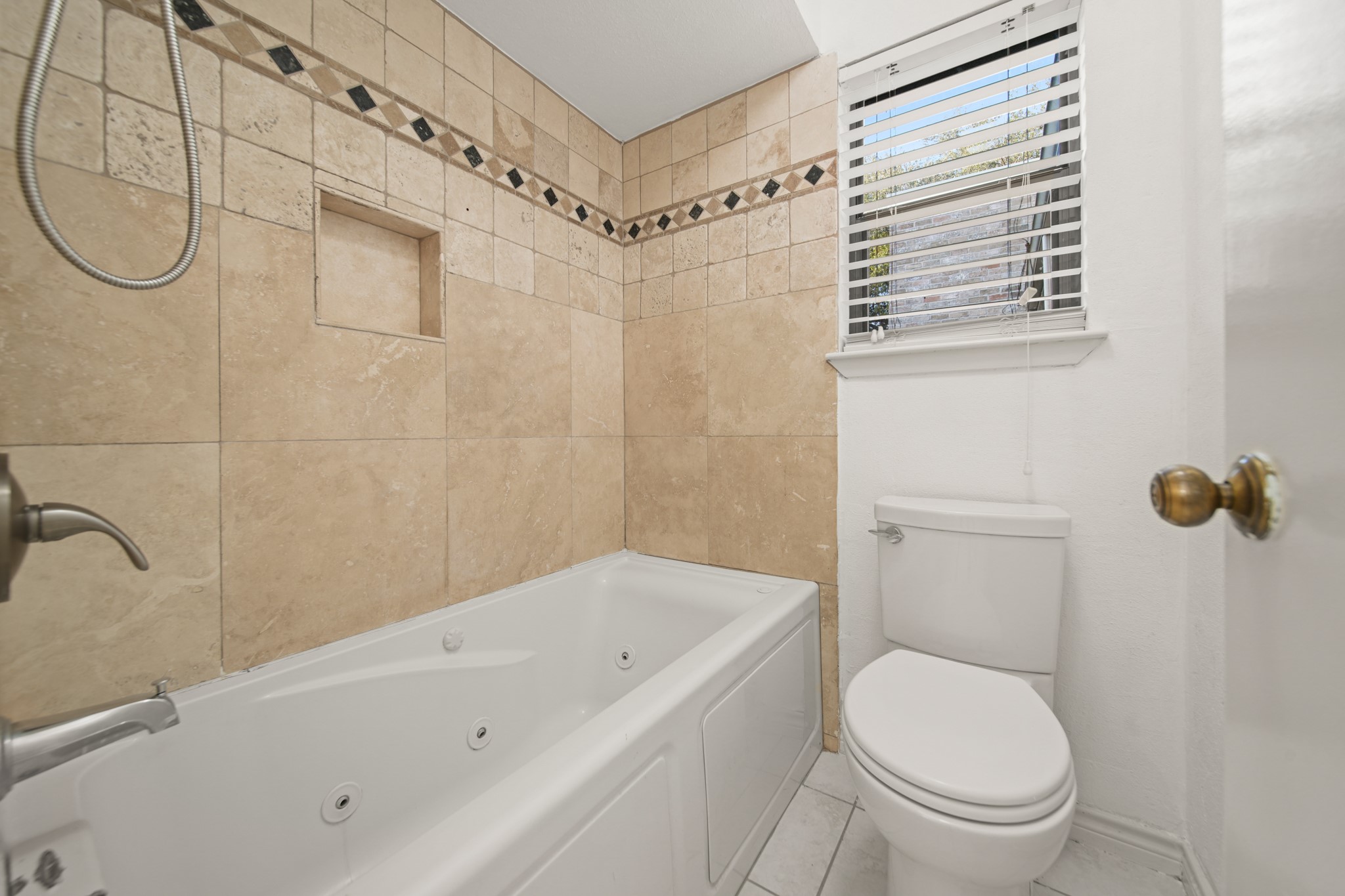 8100 Cambridge Street, Unit 6 Houston, TX 77054 - Photo 16 of 23 a bathroom with a toilet and a shower