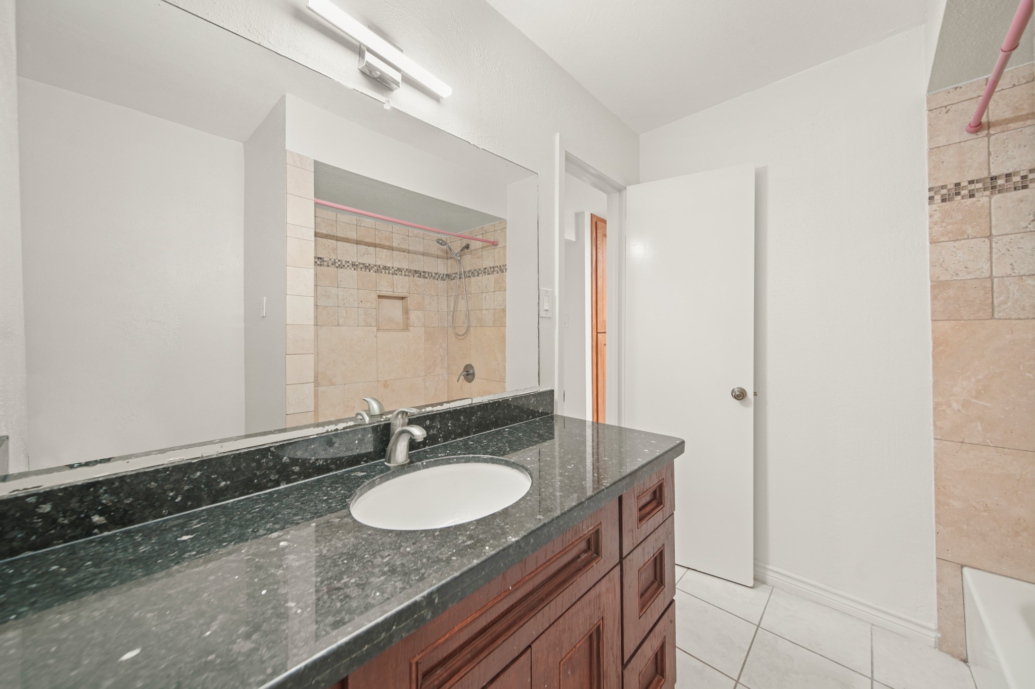 8100 Cambridge Street, Unit 6 Houston, TX 77054 - Photo 22 of 23 a sink and a mirror