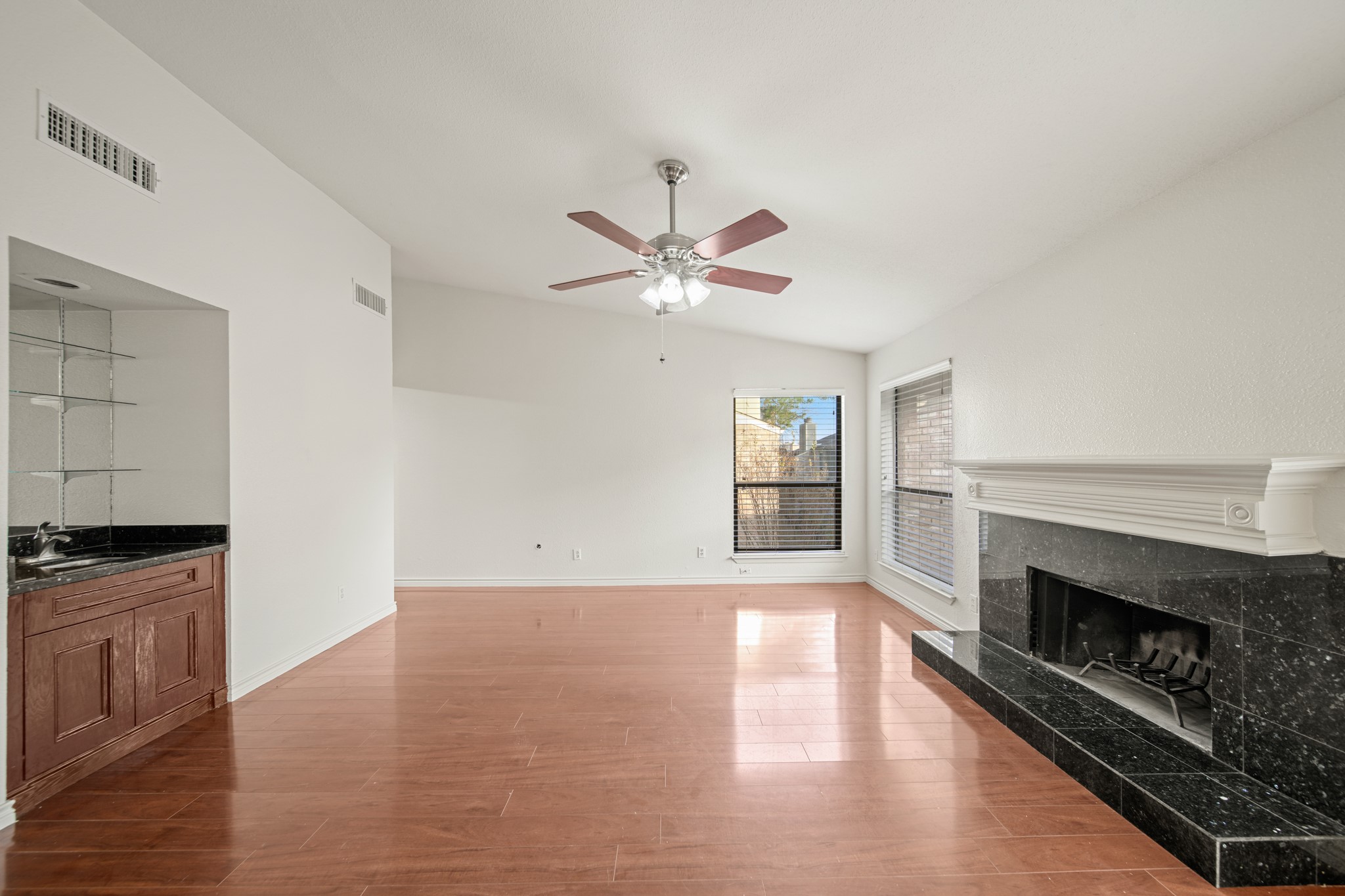 8100 Cambridge Street, Unit 6 Houston, TX 77054 - Photo 4 of 23 an empty room with windows and fireplace