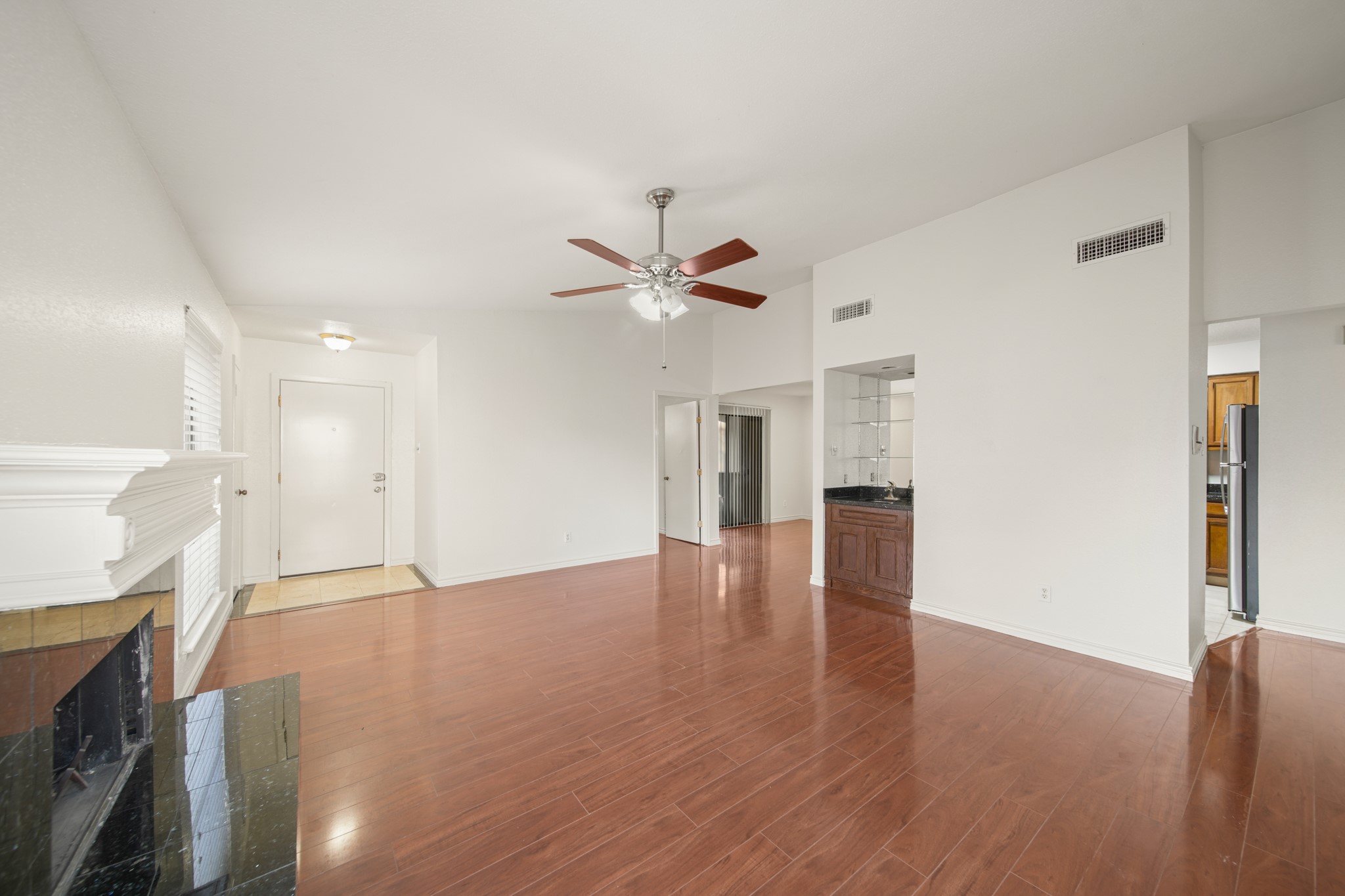8100 Cambridge Street, Unit 6 Houston, TX 77054 - Photo 5 of 23 a view of an empty room with window and wooden floor