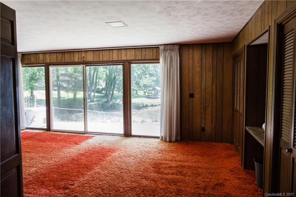 206 Brandon Road Hendersonville, NC 28739 - Photo 14 of 16 a view of an empty room with a window