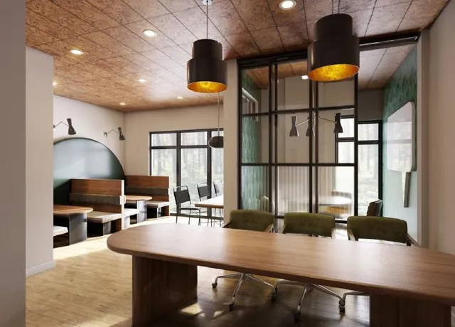 a view of a hallway with a dining table chairs and entryway