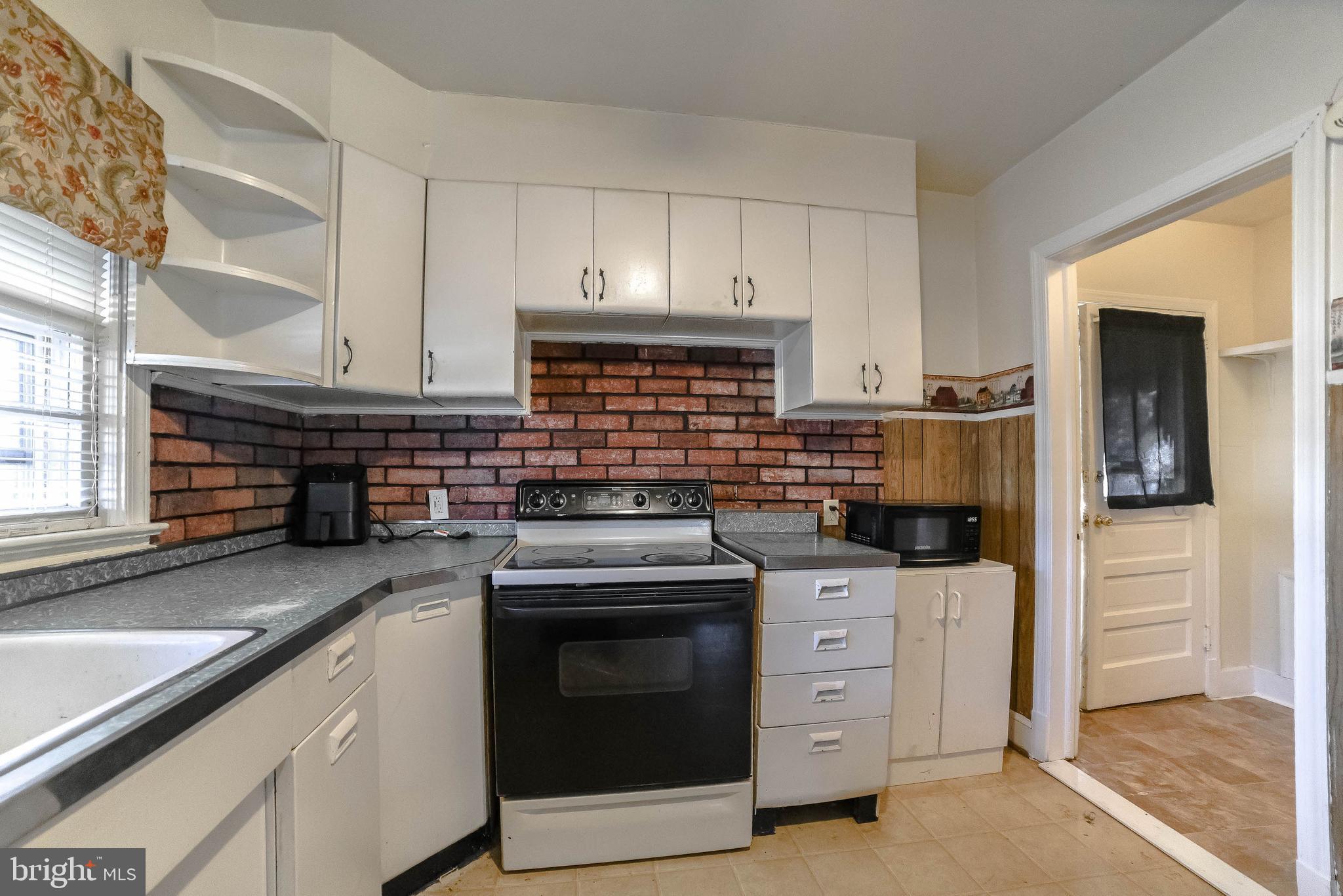 1 Prospect Avenue Indian Head, MD 20640 - Photo 11 of 44 a kitchen with stainless steel appliances granite countertop a stove and a sink