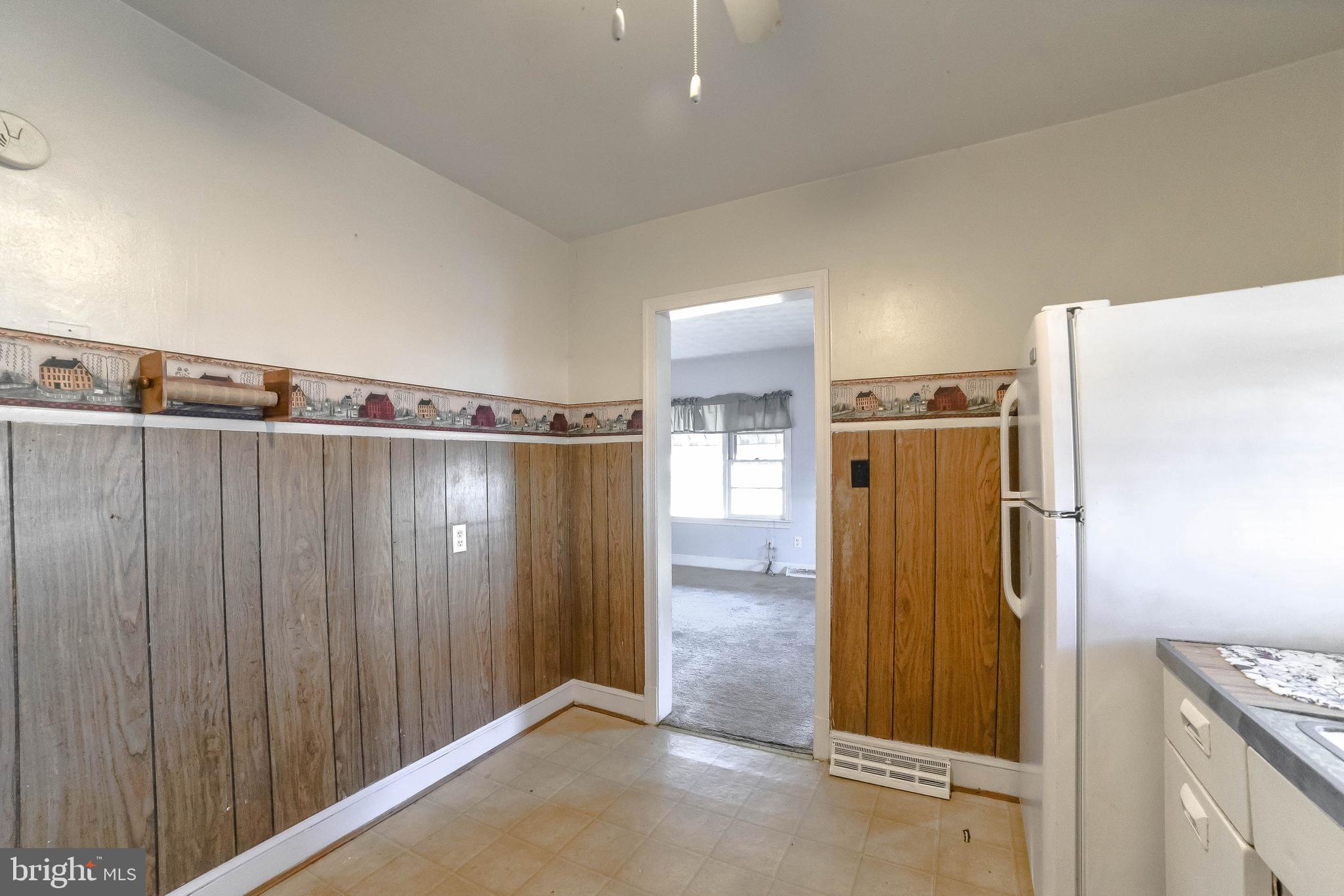 1 Prospect Avenue Indian Head, MD 20640 - Photo 12 of 44 a view of a kitchen with a refrigerator wooden floor and a cabinet