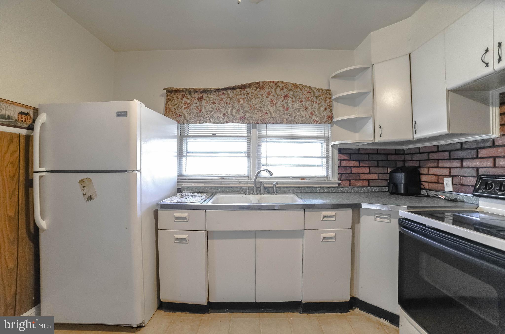 1 Prospect Avenue Indian Head, MD 20640 - Photo 13 of 44 a kitchen with stainless steel appliances granite countertop a sink stove and refrigerator