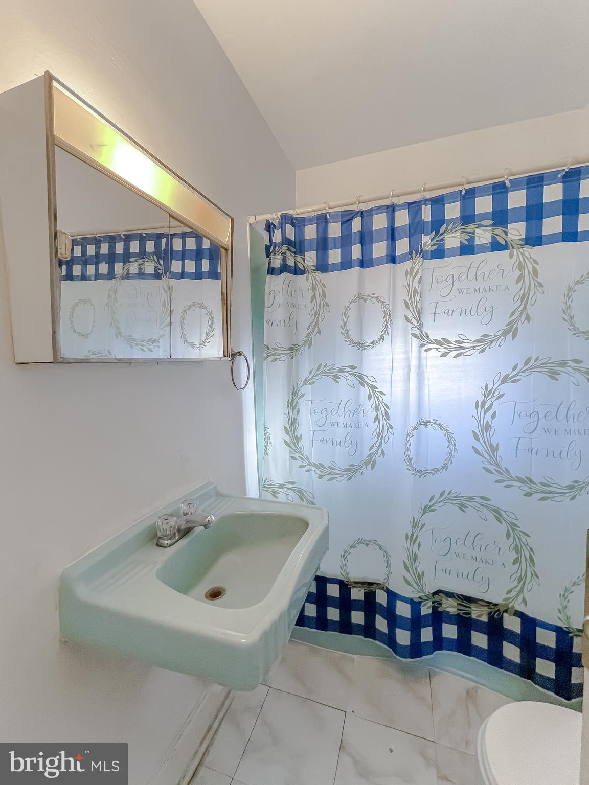 1 Prospect Avenue Indian Head, MD 20640 - Photo 22 of 44 a bathroom with a sink and a mirror