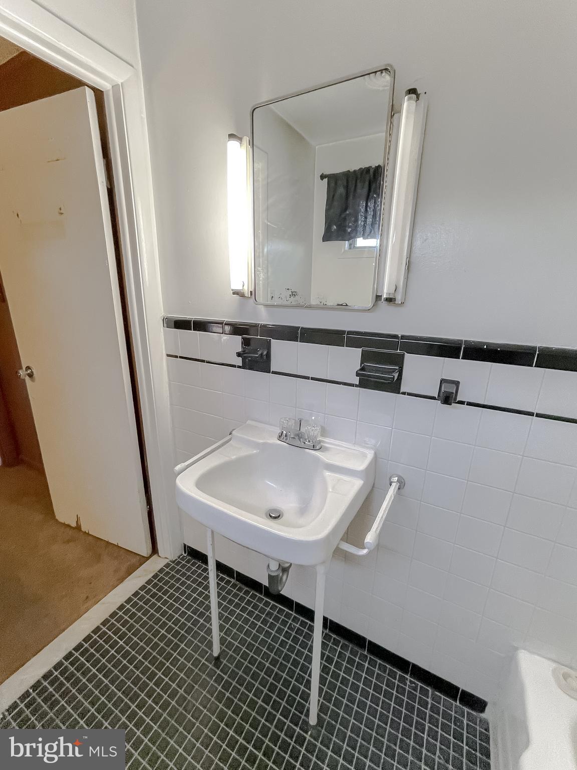 1 Prospect Avenue Indian Head, MD 20640 - Photo 43 of 44 a bathroom with a sink and a mirror