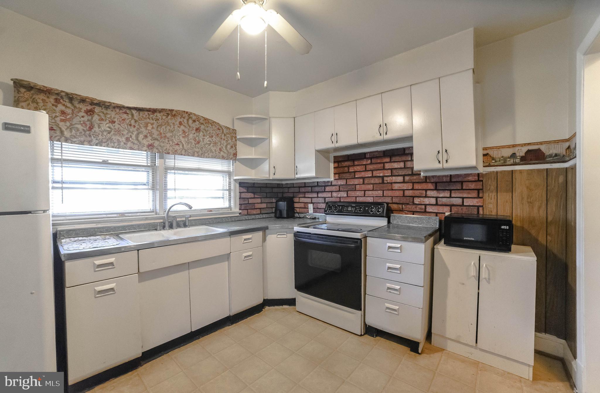 1 Prospect Avenue Indian Head, MD 20640 - Photo 10 of 44 a kitchen with stainless steel appliances a sink stove and cabinets