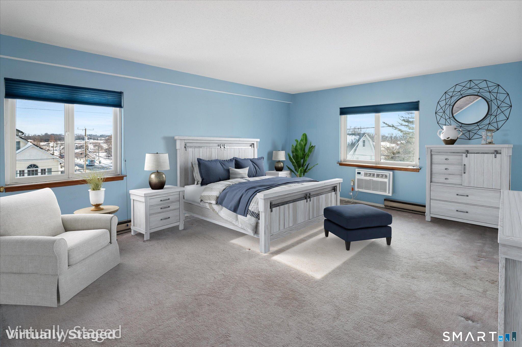 950 Cove Road, Unit B6 Stamford, CT 06902 - Photo 24 of 34 a bedroom with furniture and a large window