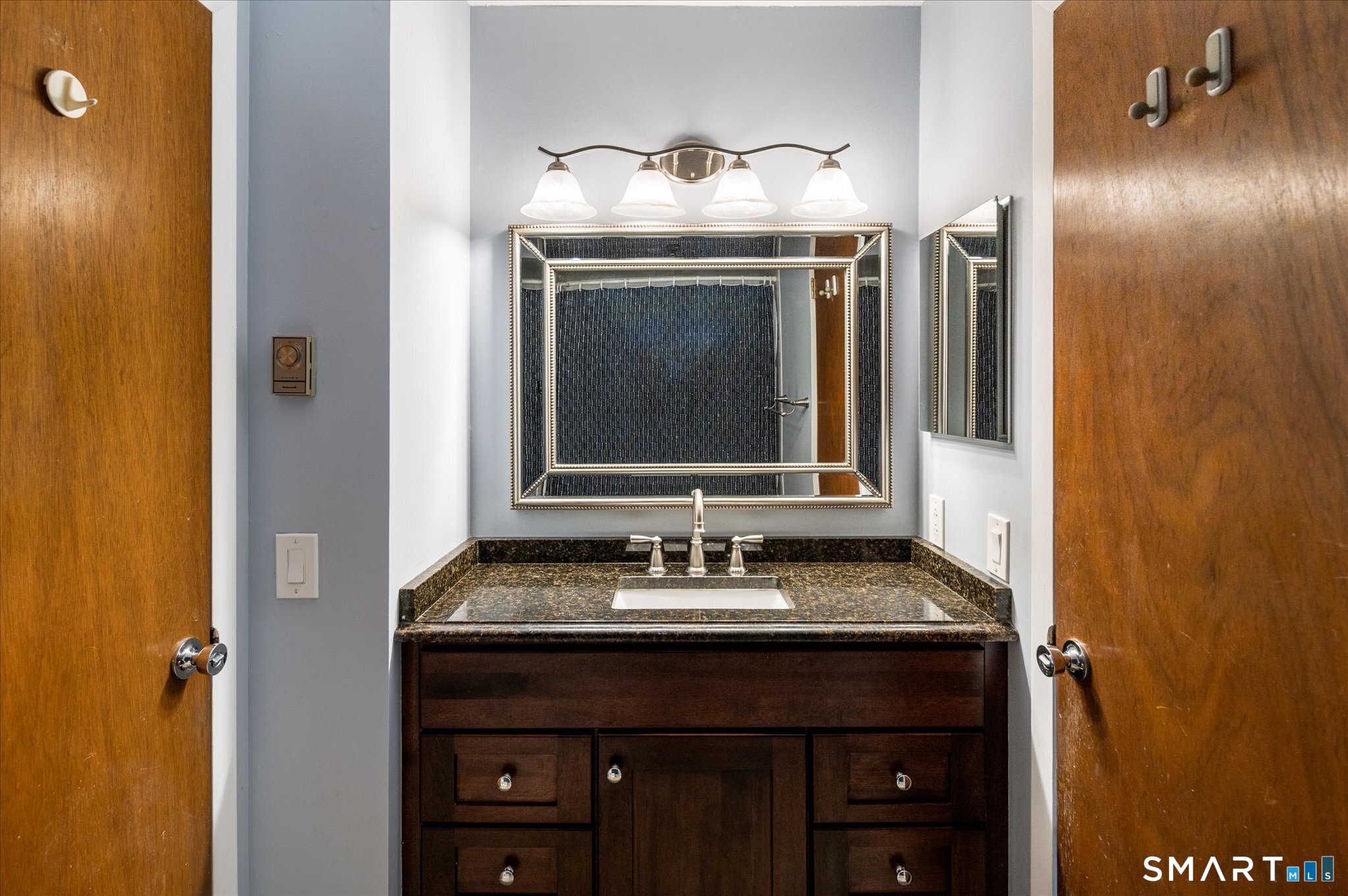 950 Cove Road, Unit B6 Stamford, CT 06902 - Photo 28 of 34 a bathroom with a sink and a mirror