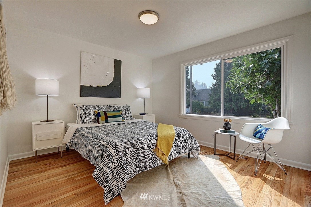 4606 South Adams Street Seattle, WA 98118 - Photo 14 of 29 a bedroom with a bed and a large window