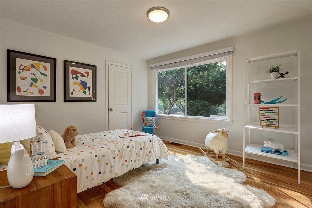 4606 South Adams Street Seattle, WA 98118 - Photo 15 of 29 a bedroom with a bed and a window