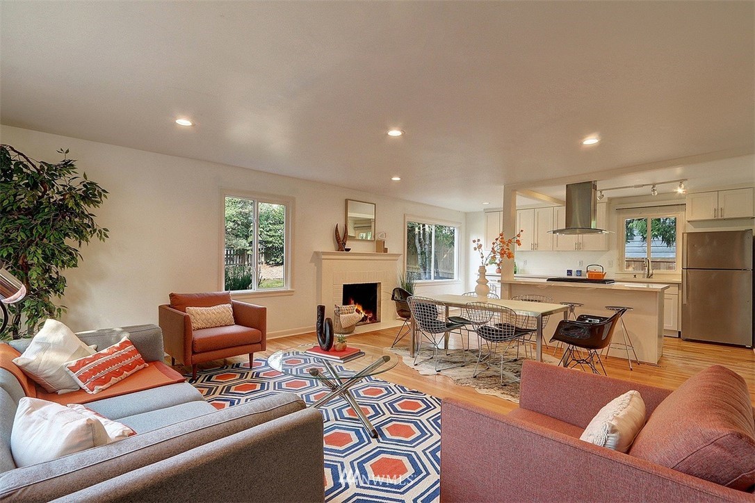 4606 South Adams Street Seattle, WA 98118 - Photo 3 of 29 a living room with furniture fireplace and a potted plant