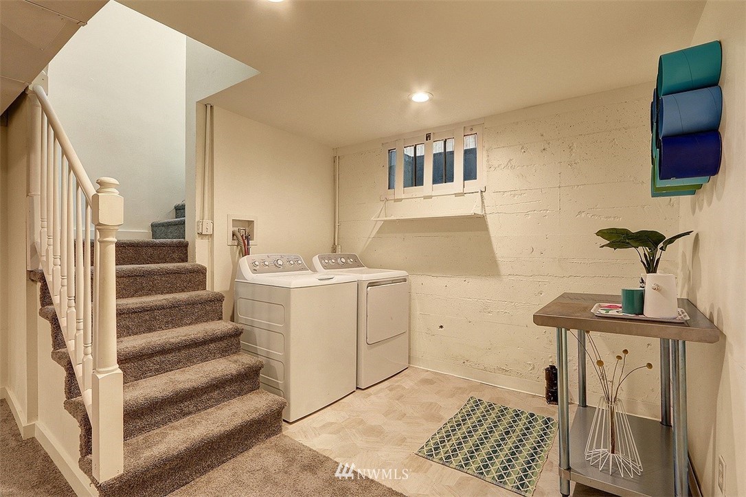 4606 South Adams Street Seattle, WA 98118 - Photo 21 of 29 a view of a hallway with washer and dryer