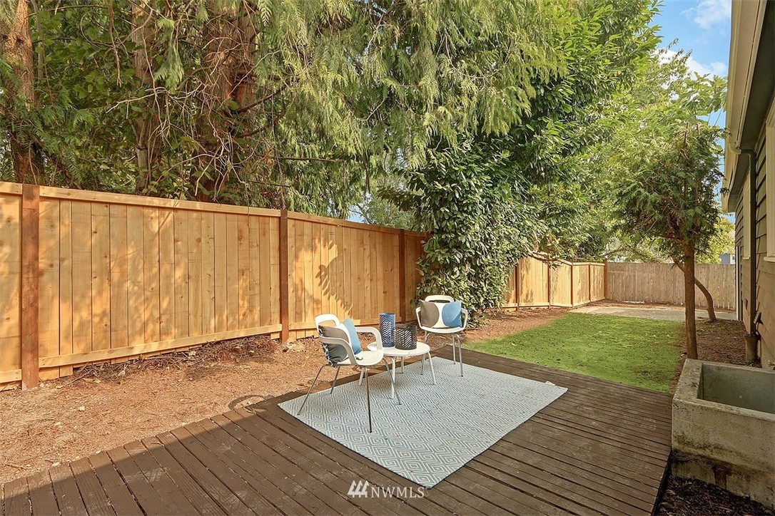 4606 South Adams Street Seattle, WA 98118 - Photo 27 of 29 a backyard of a house with outdoor seating